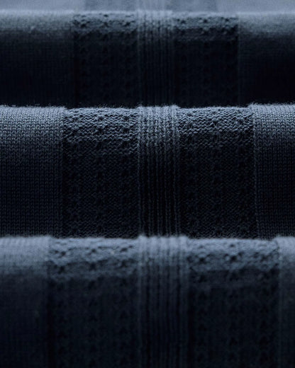 The Button Down Polo in Dark Navy Stripe